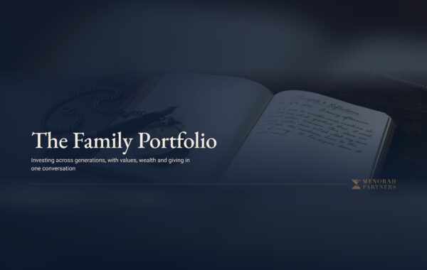 An open handwritten journal, a fountain pen and a vintage pocket watch on a dark wooden desk, with the title "The Family Portfolio" and the Menorah Partners logo