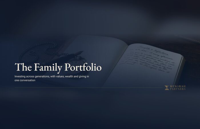 An open handwritten journal, a fountain pen and a vintage pocket watch on a dark wooden desk, with the title "The Family Portfolio" and the Menorah Partners logo